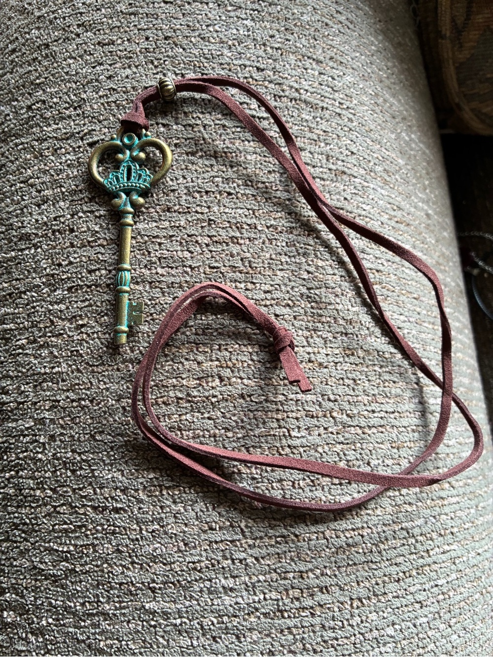 Bronze key necklace with green patina on a suede adjustable 17” cord